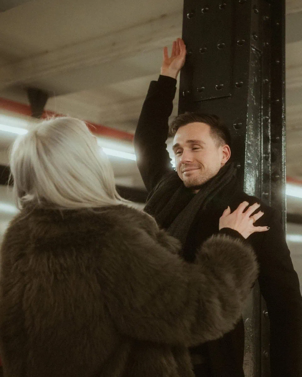 a man in a coat and a woman in a fake fur coat