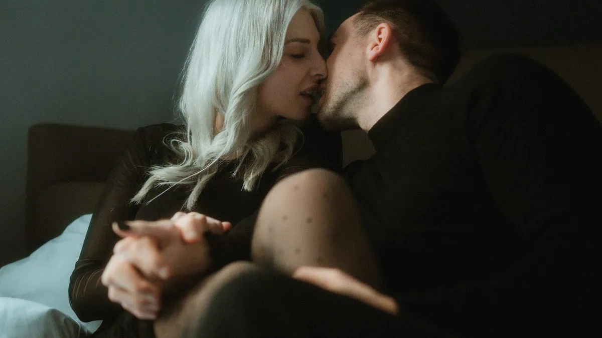 a man and woman kissing