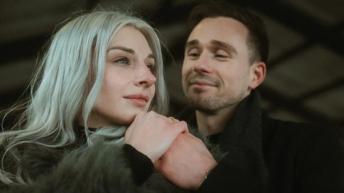 a man and woman looking at each other